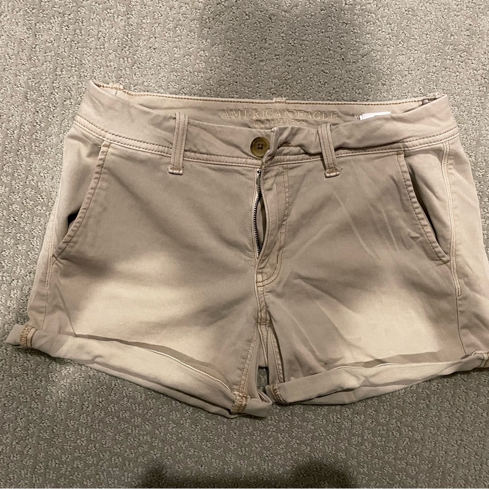 Three pairs of American Eagle shorts.